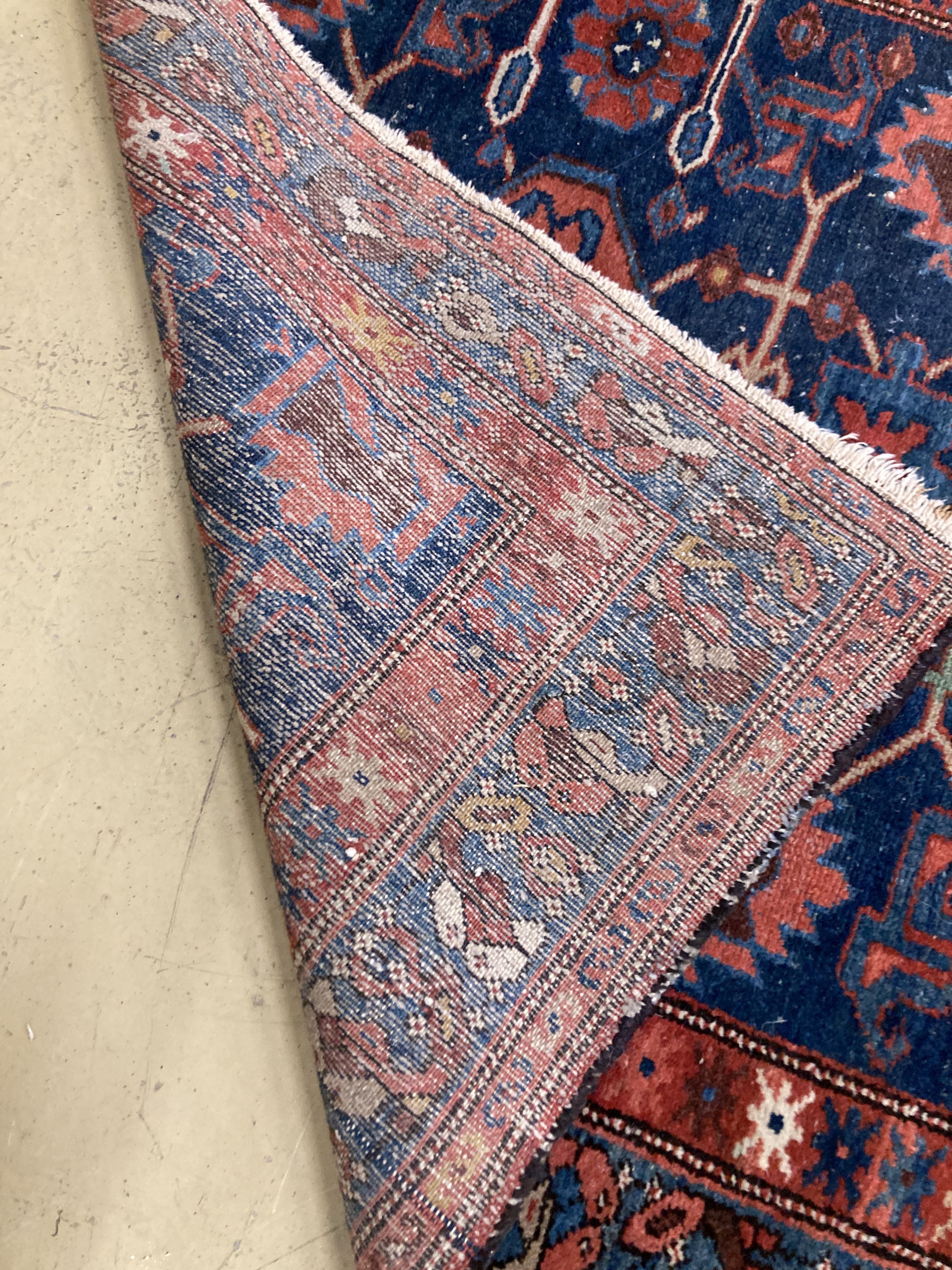 An antique Hamadan blue ground rug, 180 x 104cm